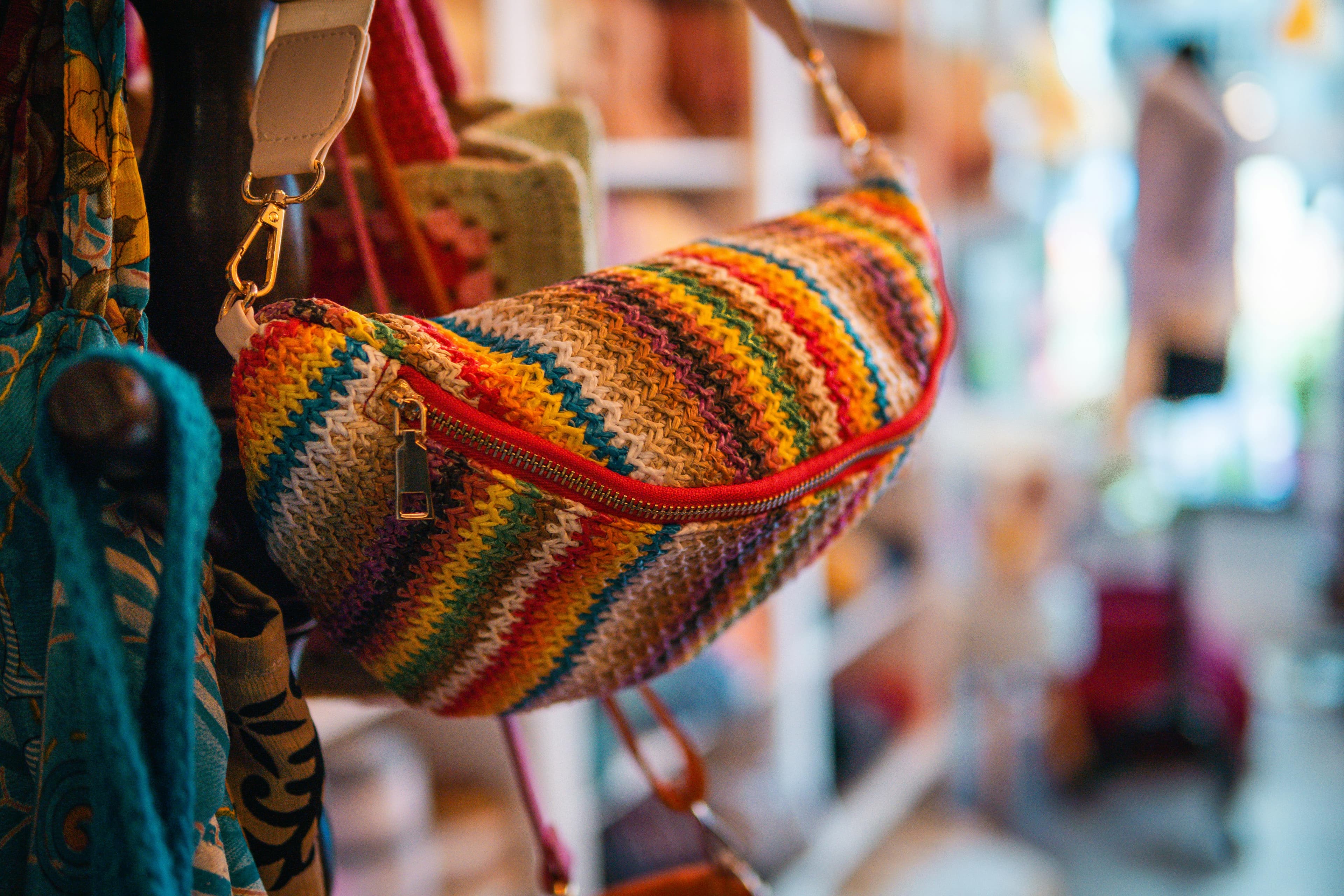 Vibrant handcrafted shoulder bag on display in a stylish boutique.